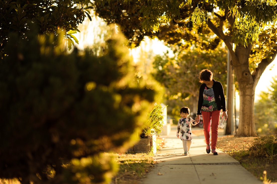 woman walking with child