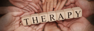 therapy in block letters